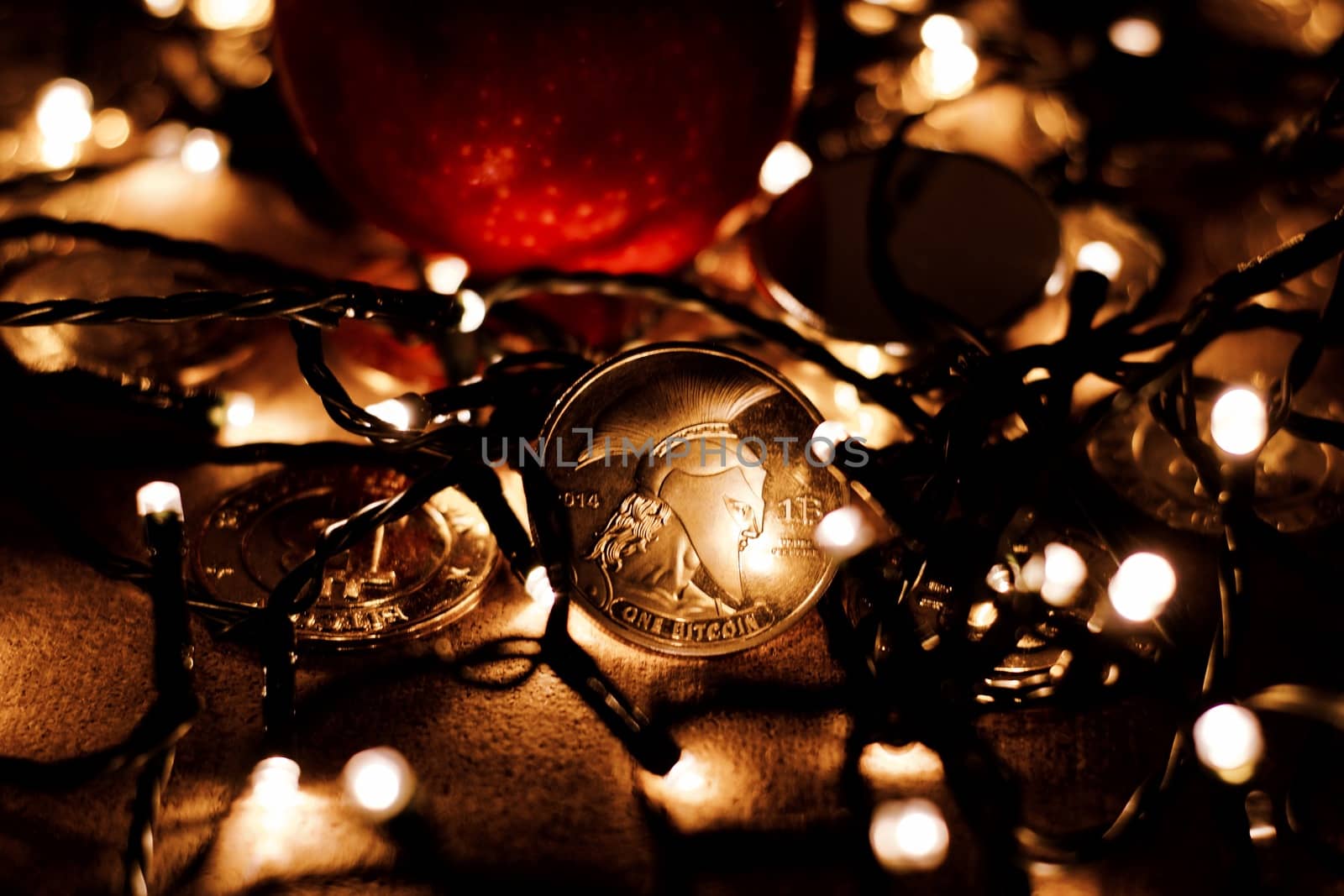 Digital currency physical metal bitcoin coin. Christmas cryptocurrency concept.