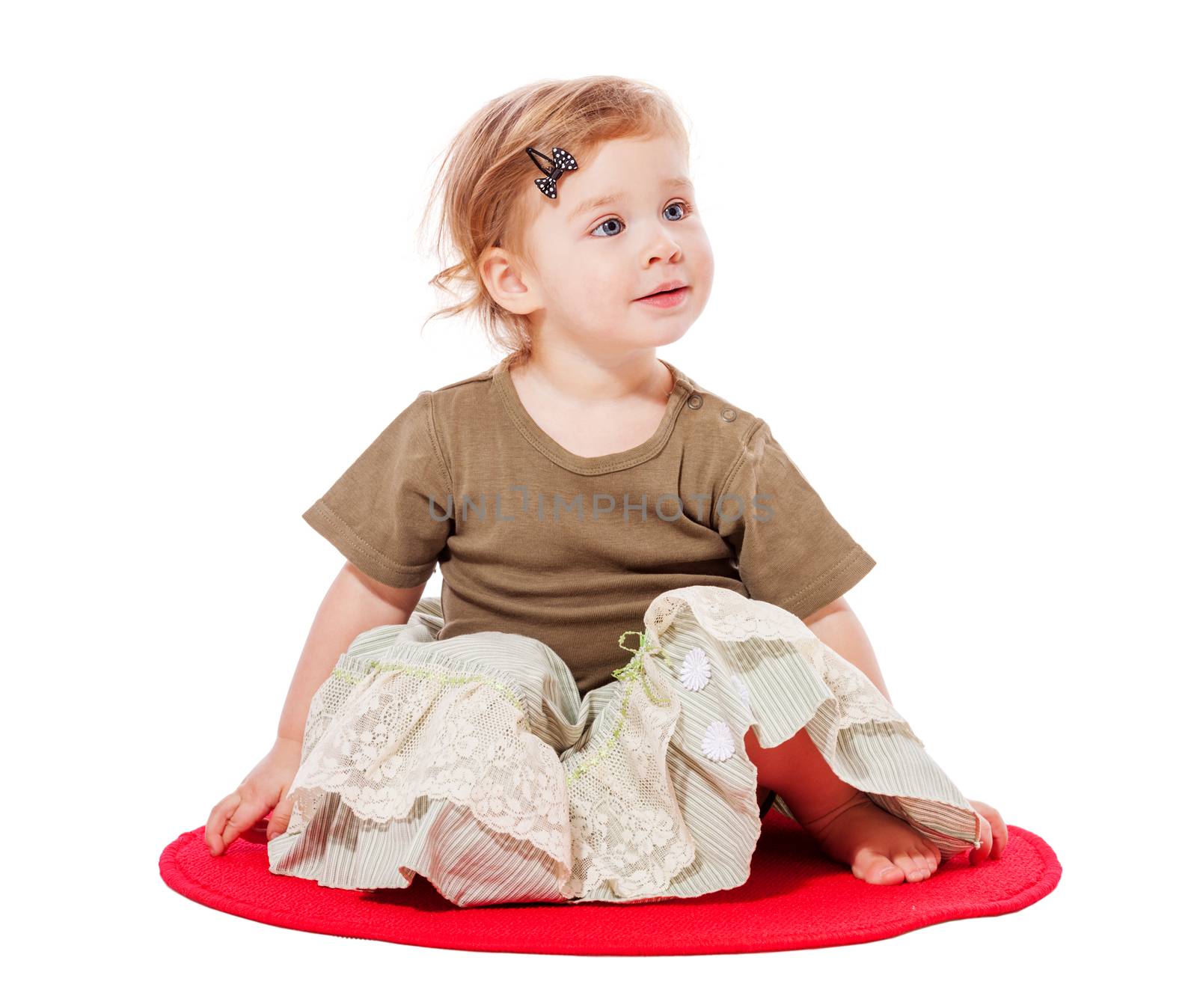 Baby sitting on floor isolated on white