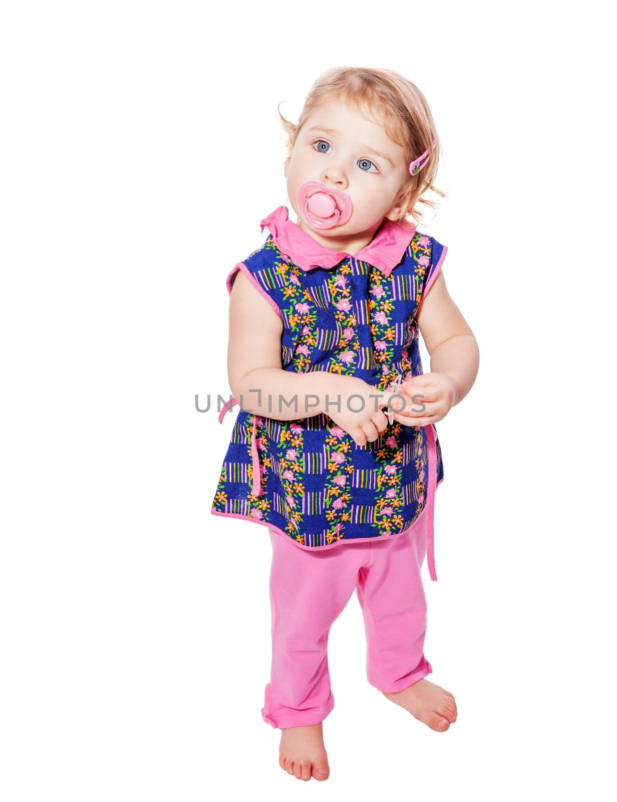 Little girl wearing pink clothes isolated on white