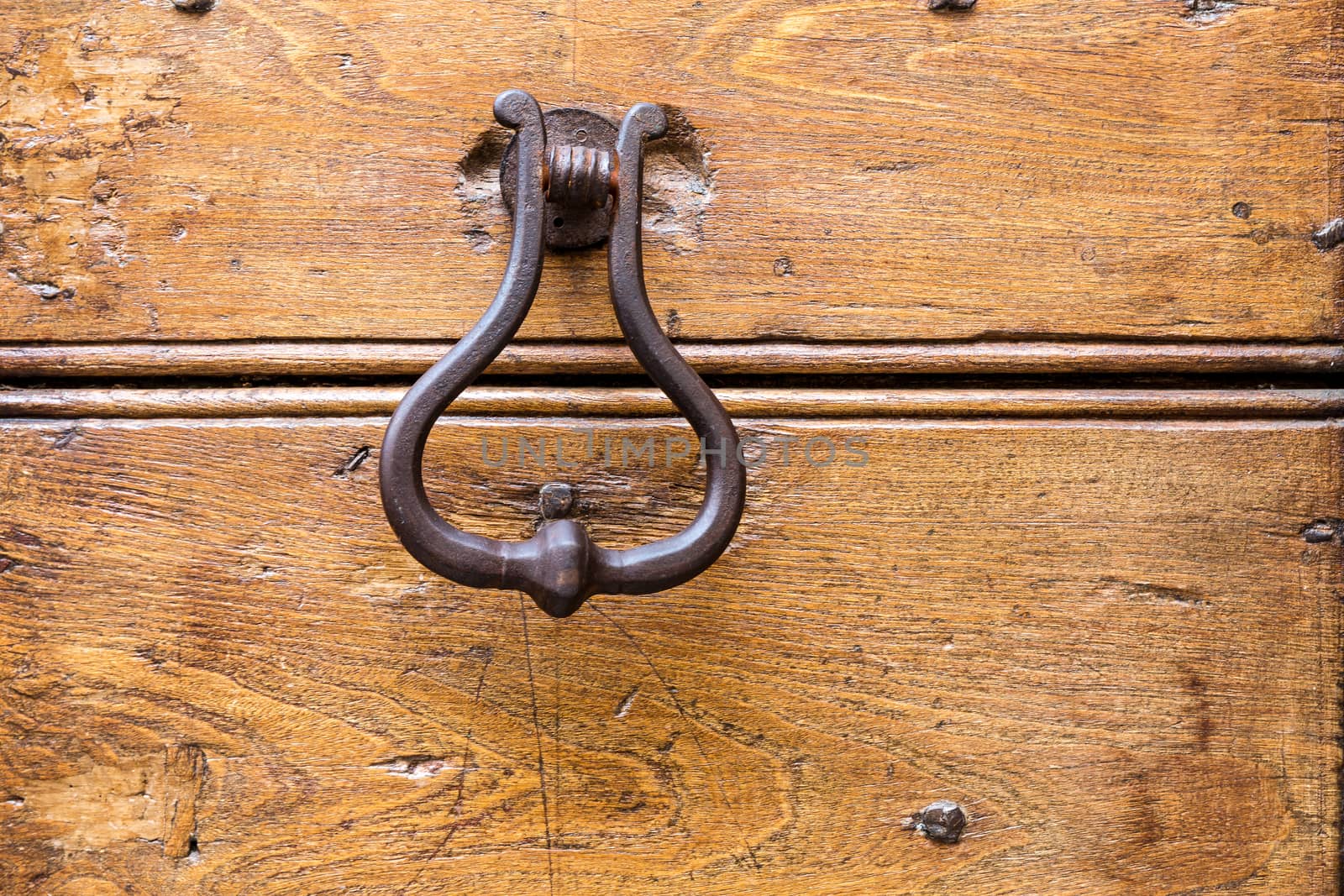 Close up of rustic old door in Spoleto, Italy.