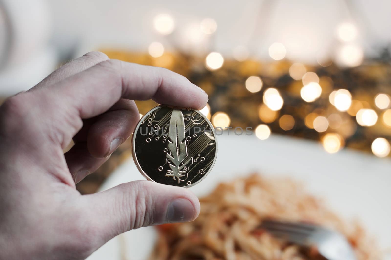 Digital currency physical gold feather coin. Italian pasta food concept.