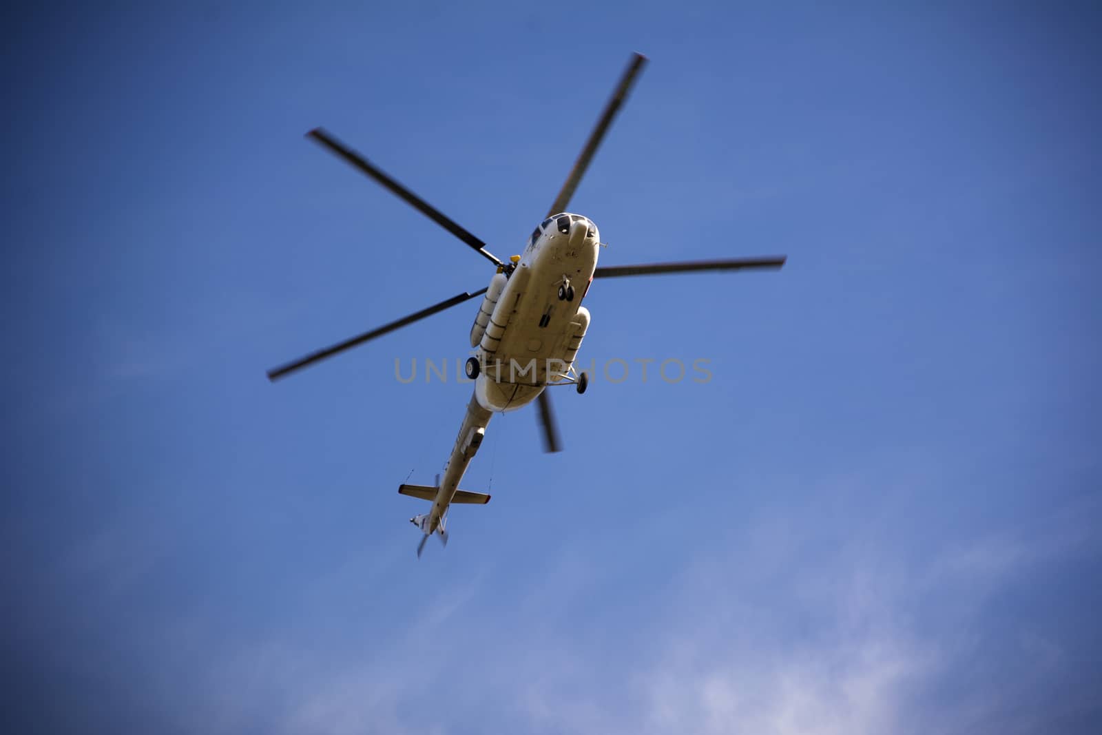 Passenger russian helicopter fly in sky.