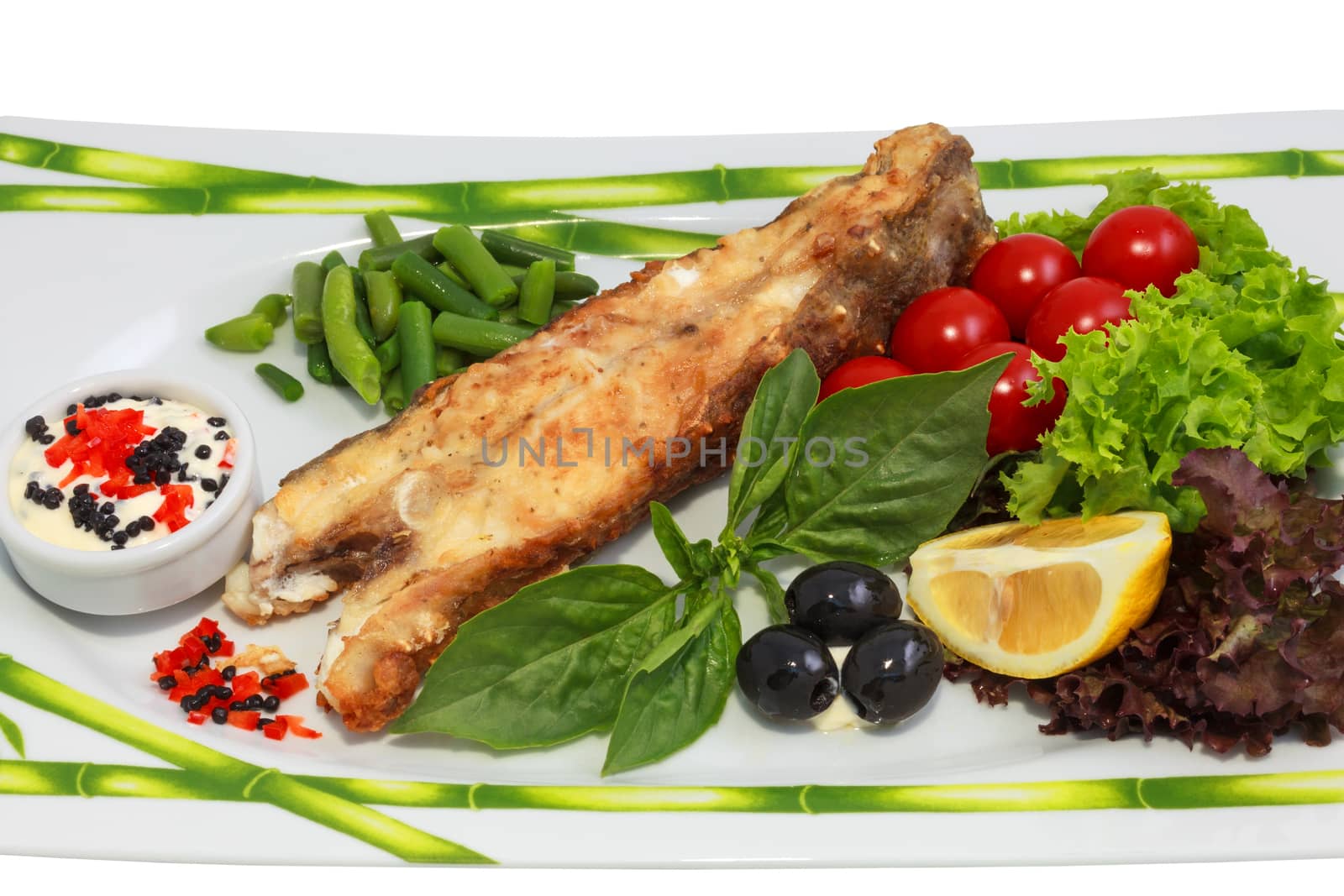 freshly cooked fish and fresh vegetables on the plate