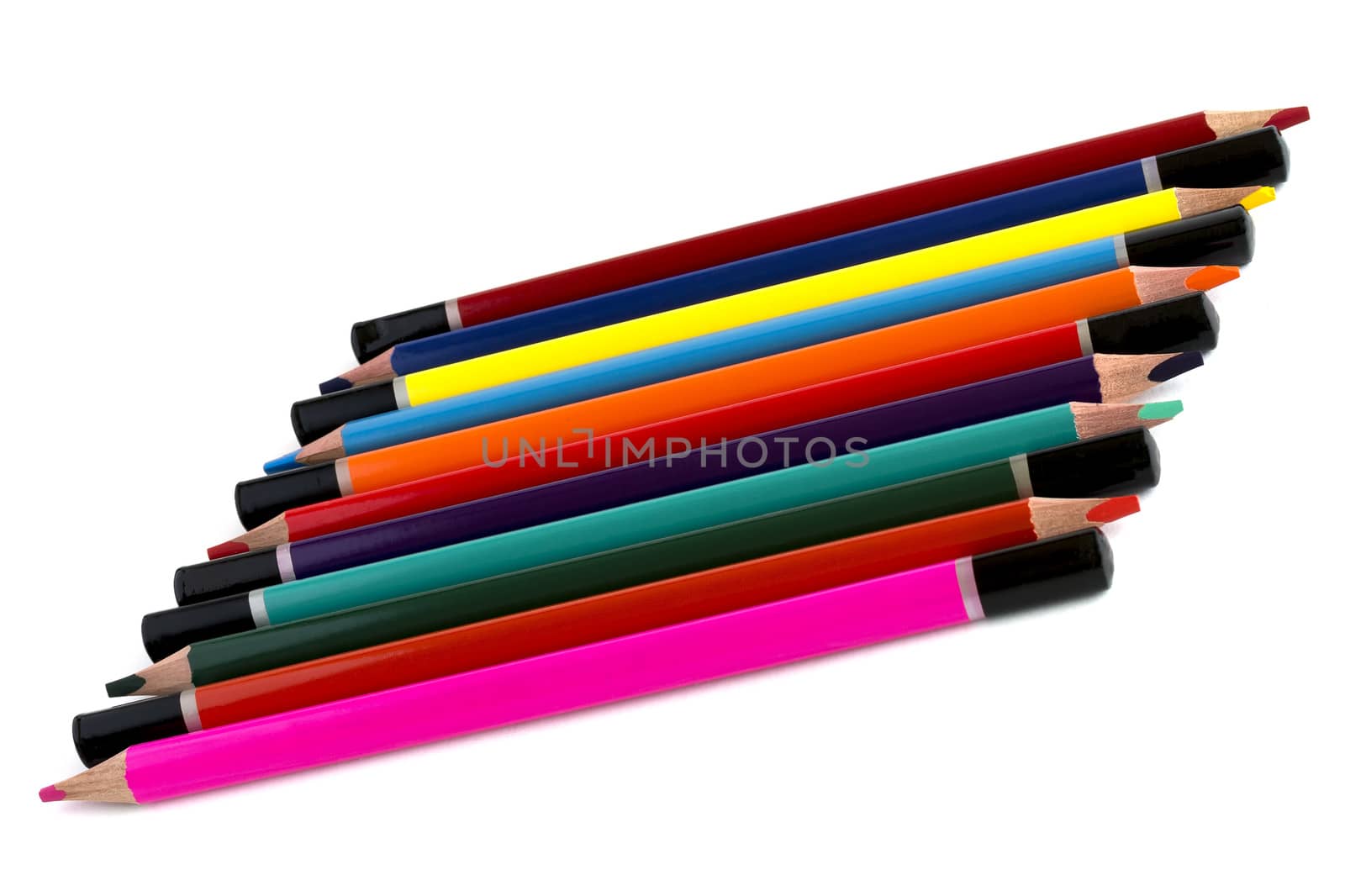Baby colored pencils in a row, isolated on a white background