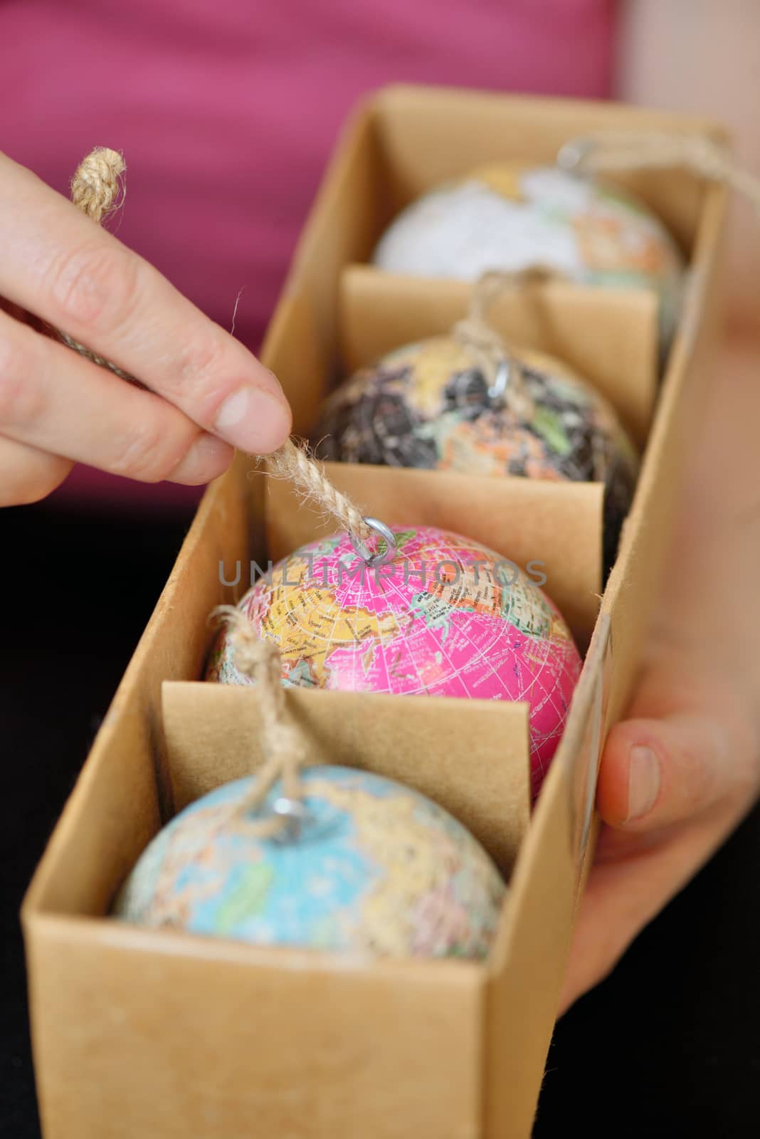 Christmas balls shaped as globe or planet in box