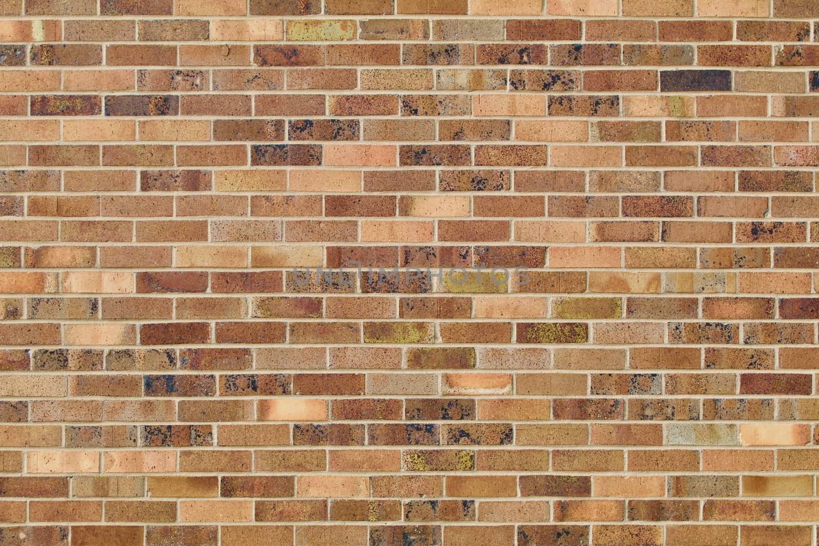 Tan and brown brick wall background