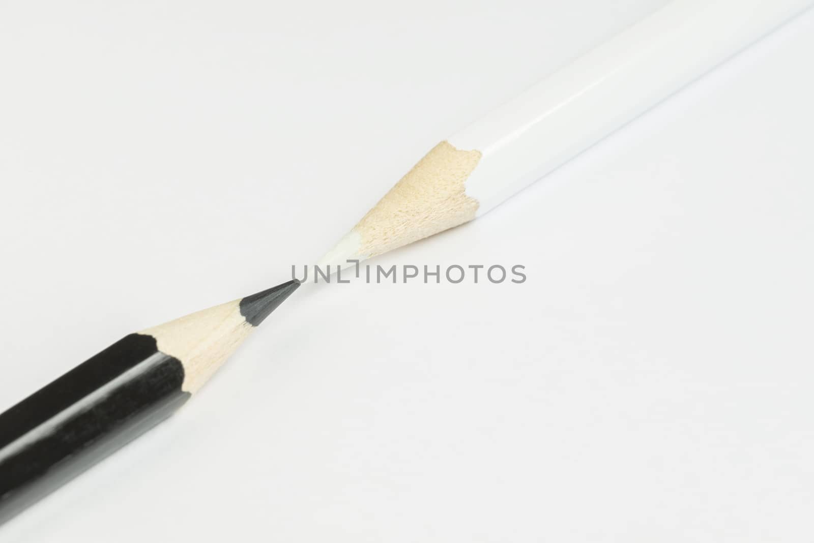 Black and white pencil as conceptual imagination of opposites
