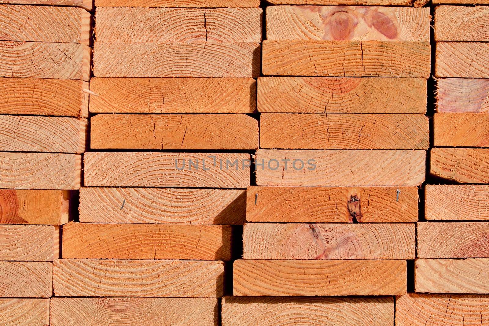 End view of stacked wooden planks