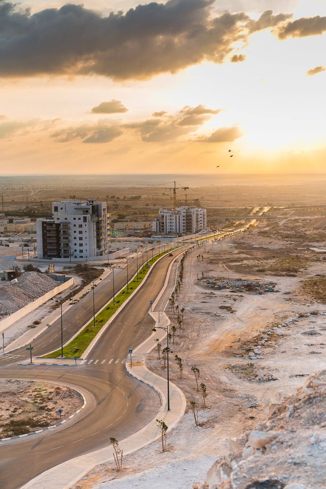 construction work in the desert, crane and building
