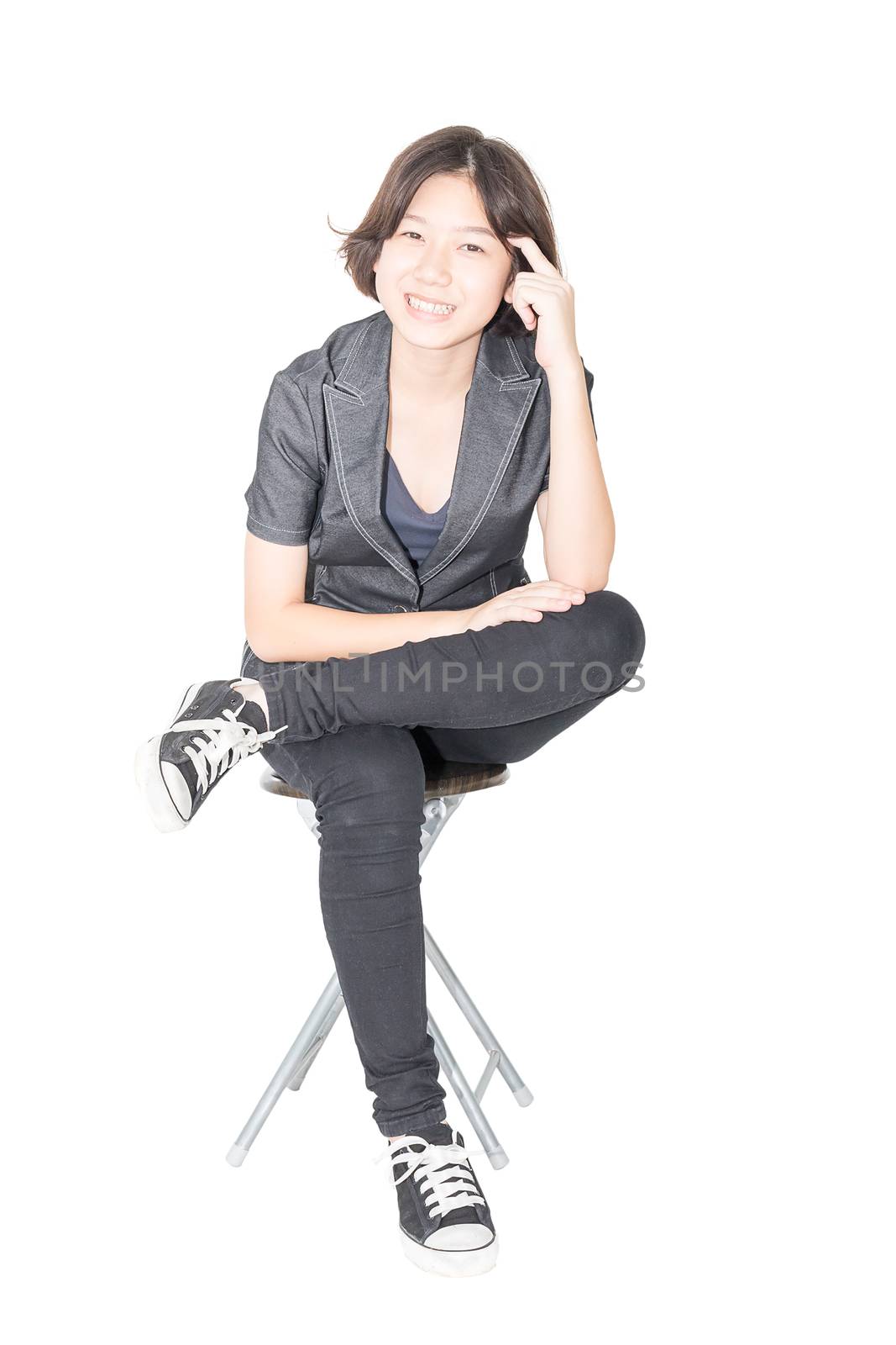 Young women sit on chair over white by stoonn