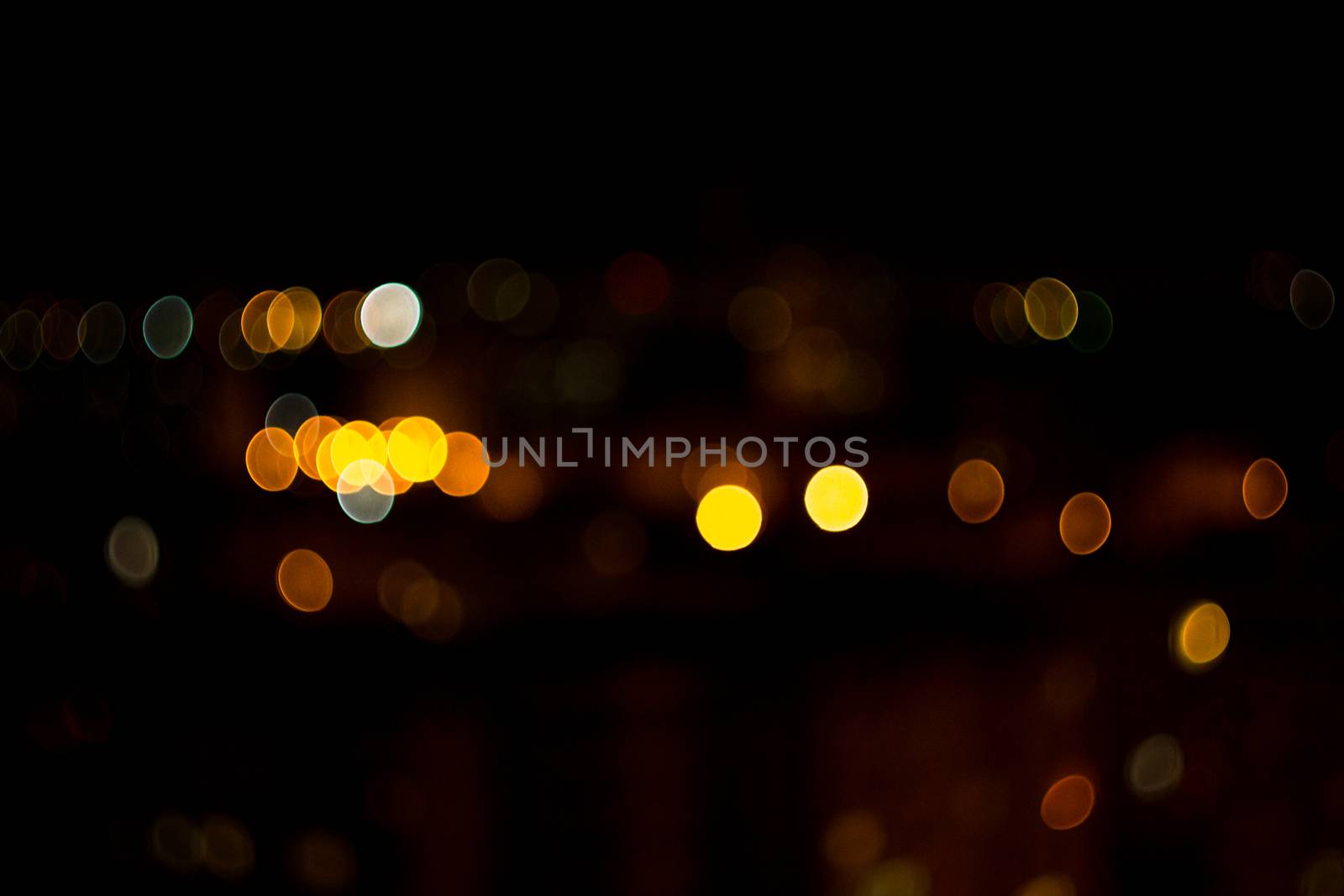 yellow lights on a black background abstraction night city