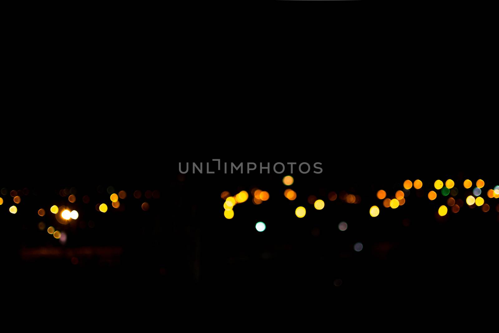 yellow lights on a black background abstraction night city