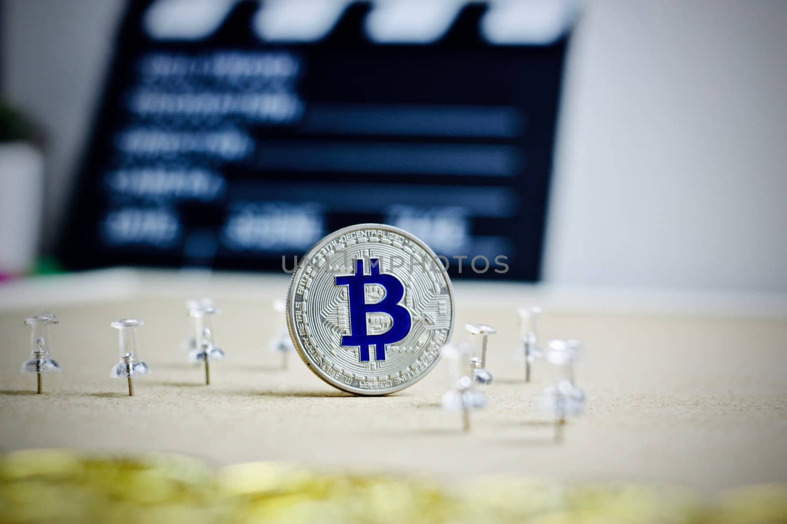Digital currency physical metal bitcoin coin. Cryptocurrency cinema concept.