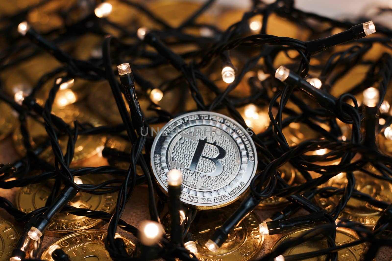 Digital currency physical metal bitcoin coin on the christmas concept.