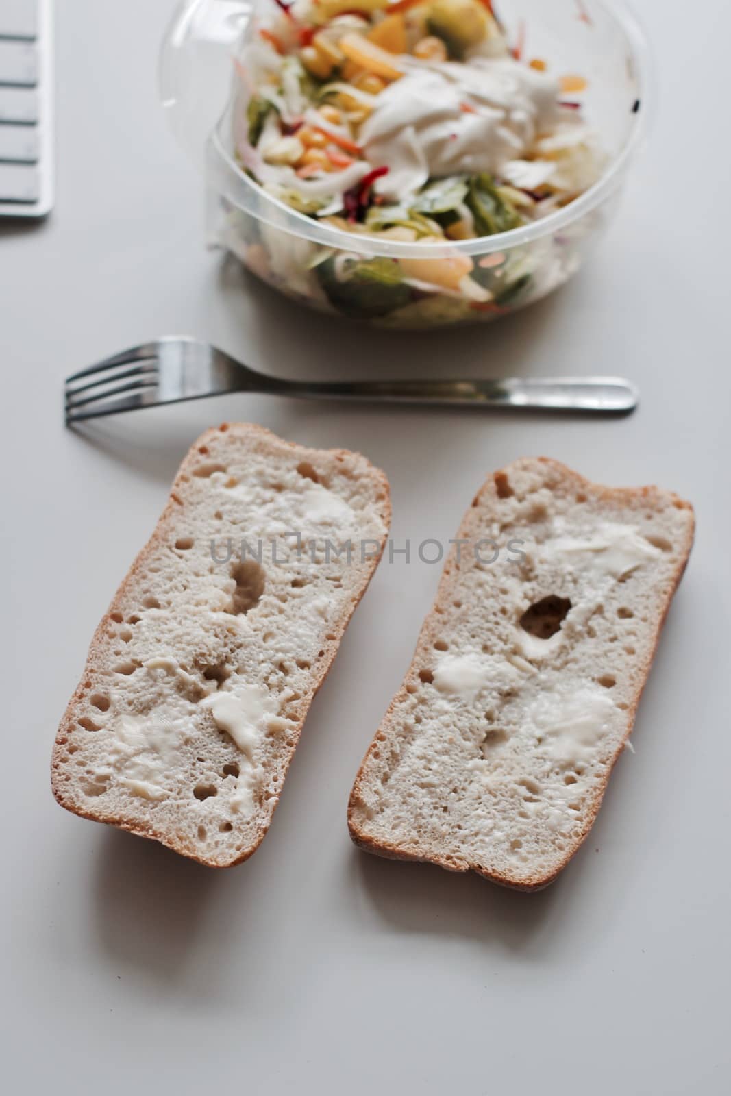 Eat near computer keyboard. Delicious fresh salad with mayo.