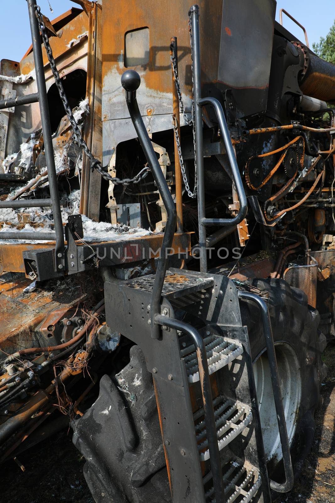 Closeup of a burnt out combine harvester