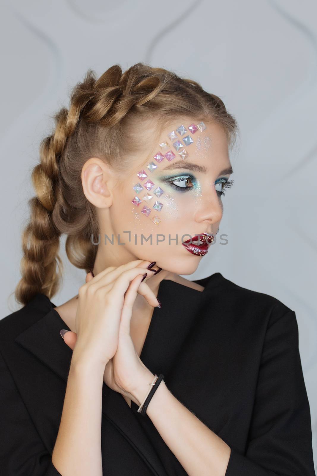 Fashion makeup. Woman with colorful makeup and body art.