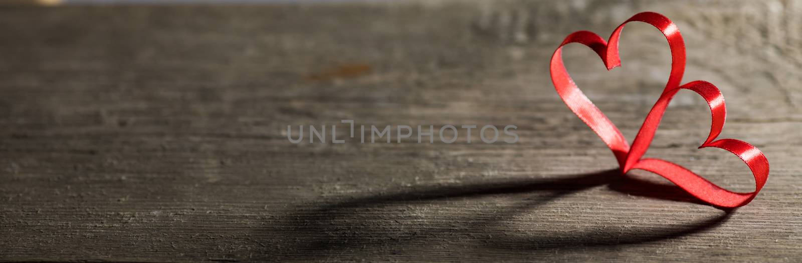 Two red ribbon hearts on wooden backround, Valentine day concept