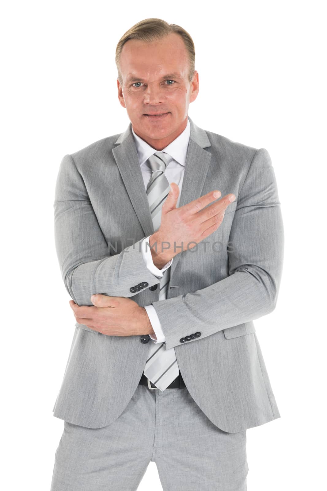 Portrait of smiling mature businessman wearing gray suit isolated on white background