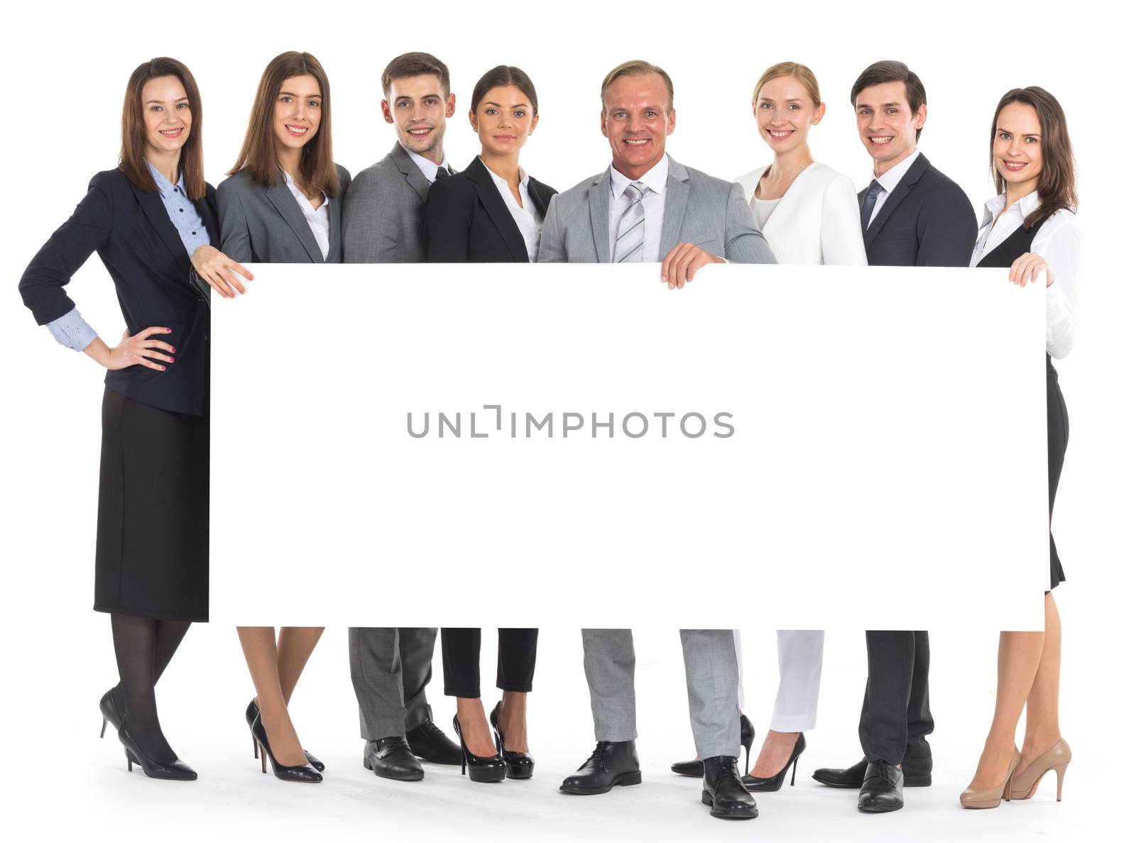 Group of business people holding a banner ad isolated on white