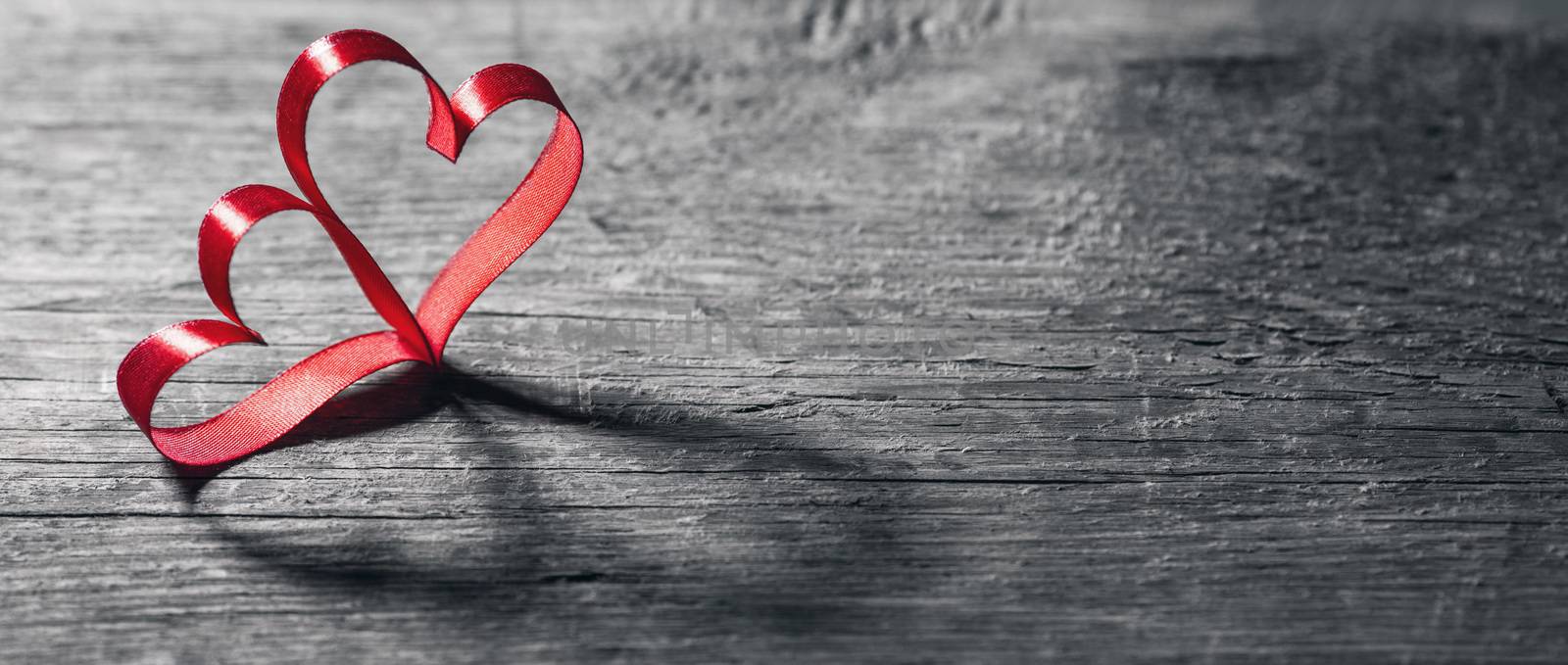 Two red ribbon hearts on wooden backround, Valentine day concept