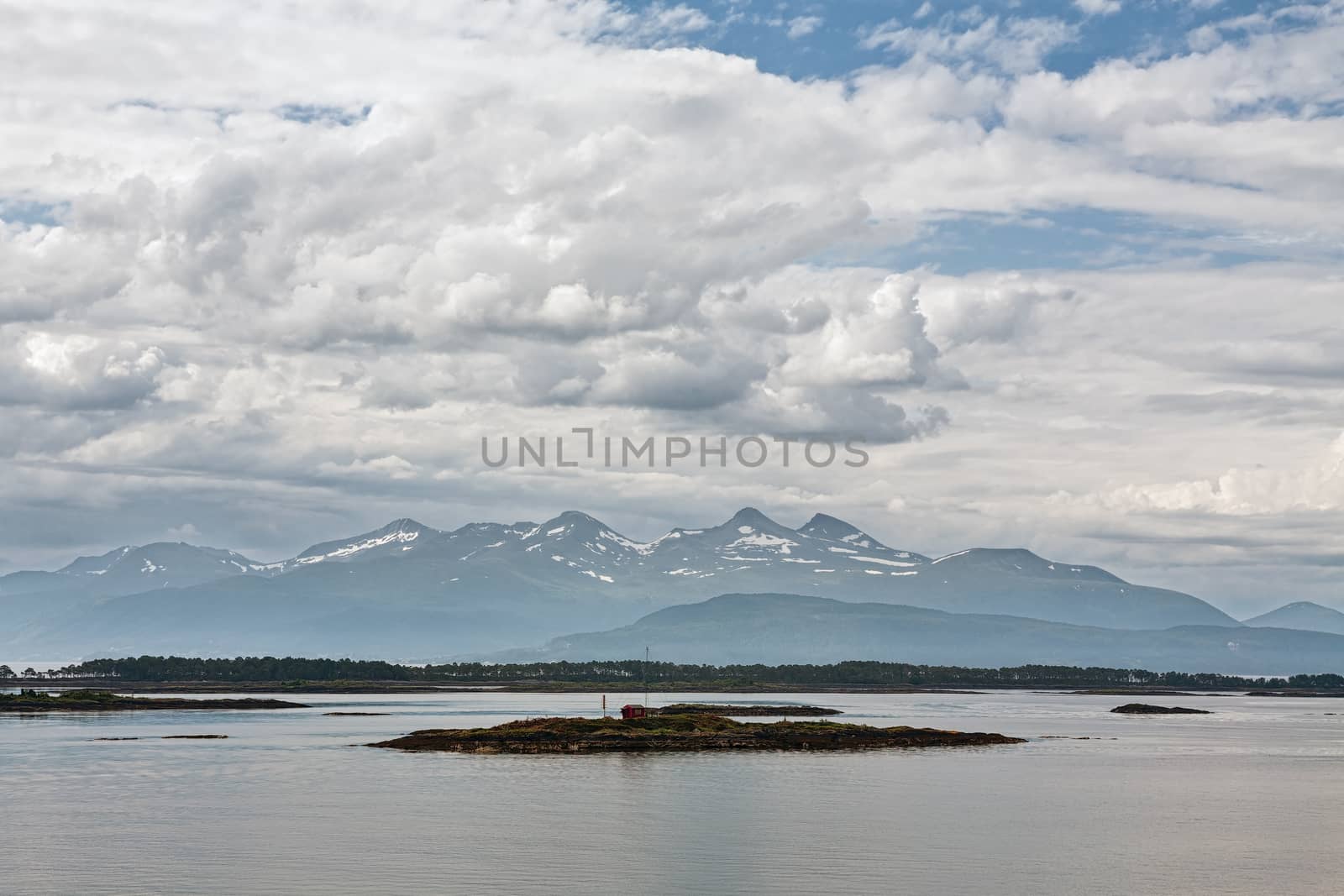 Panoramic mountain view with a house in an island in the fjord in Molde, Norway