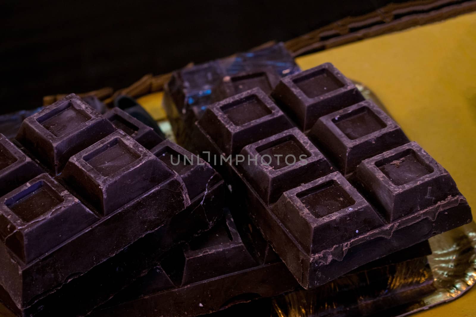 Some bars of dark chocolate with squares