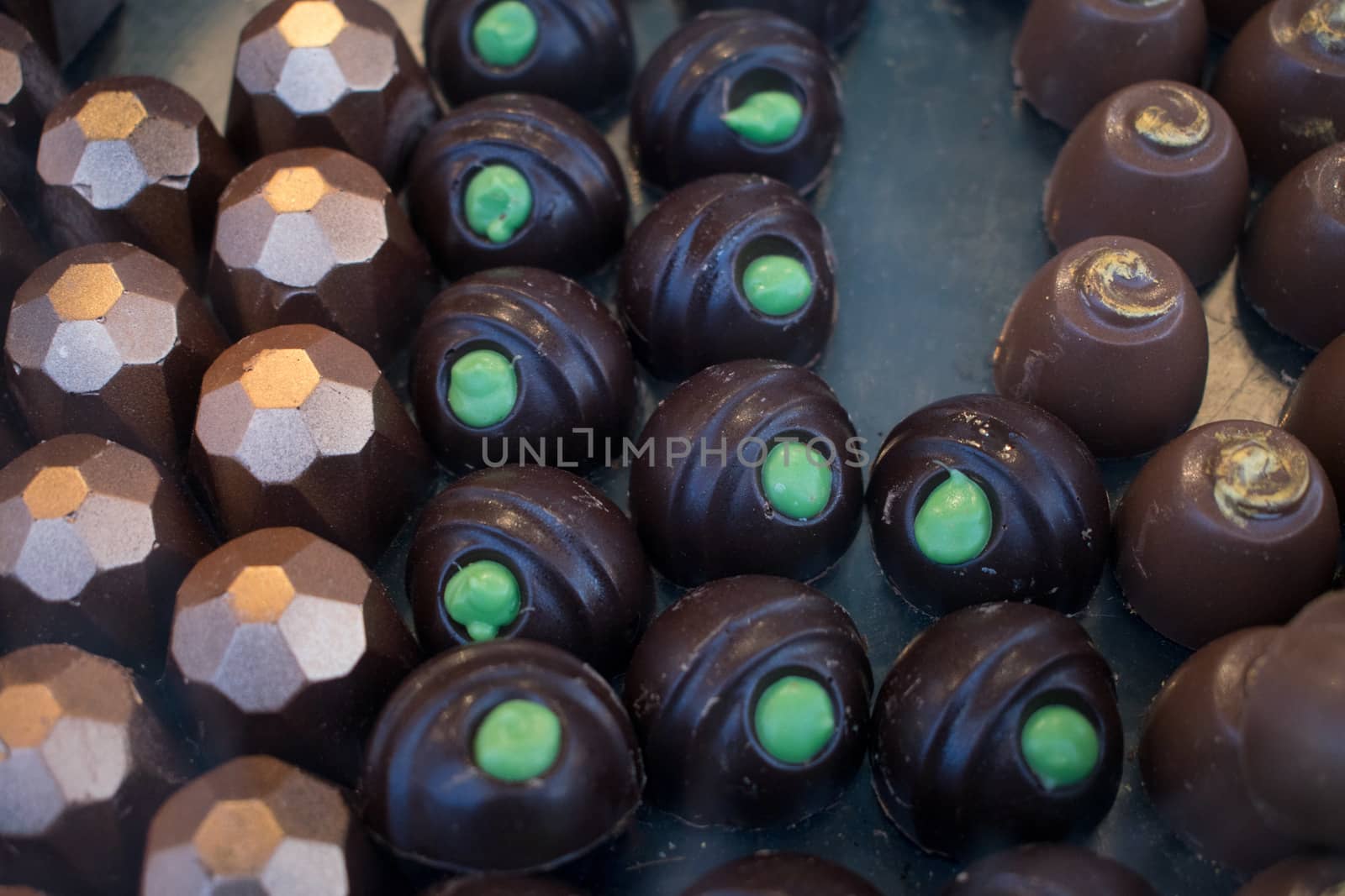 A group of pralines in a pastry shop