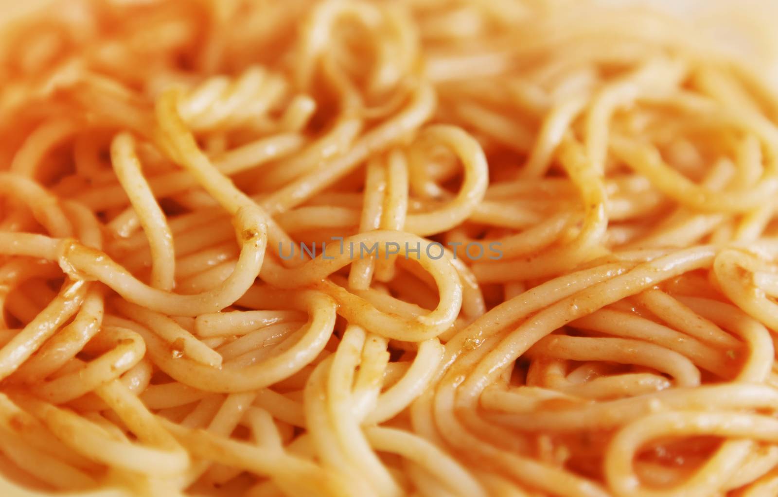 close up of spaghetti in sauce