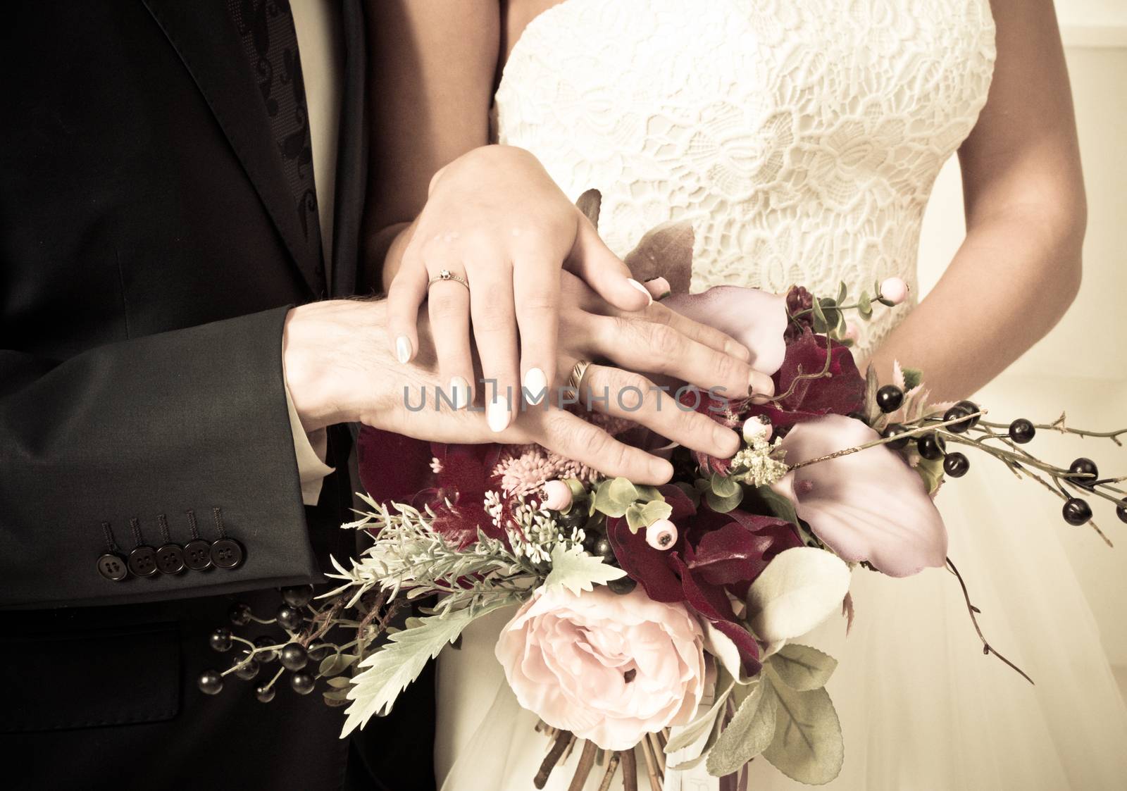 Wedding bouquet in bride's hand by ALotOfPeople