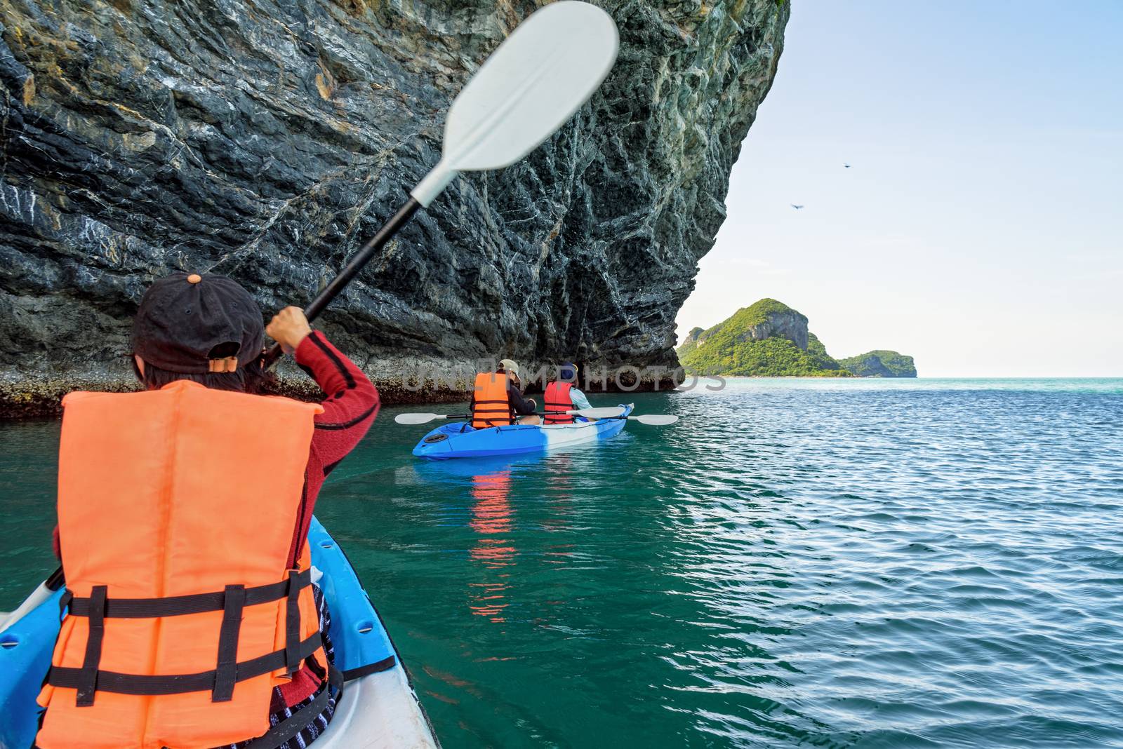 Group of tourists on a kayak.Travel by boat around Ko Phi enjoy the beautiful nature of the sea and islands in the summer at Mu Ko Ang Thong National Marine Park in Gulf of Thailand, Surat Thani province