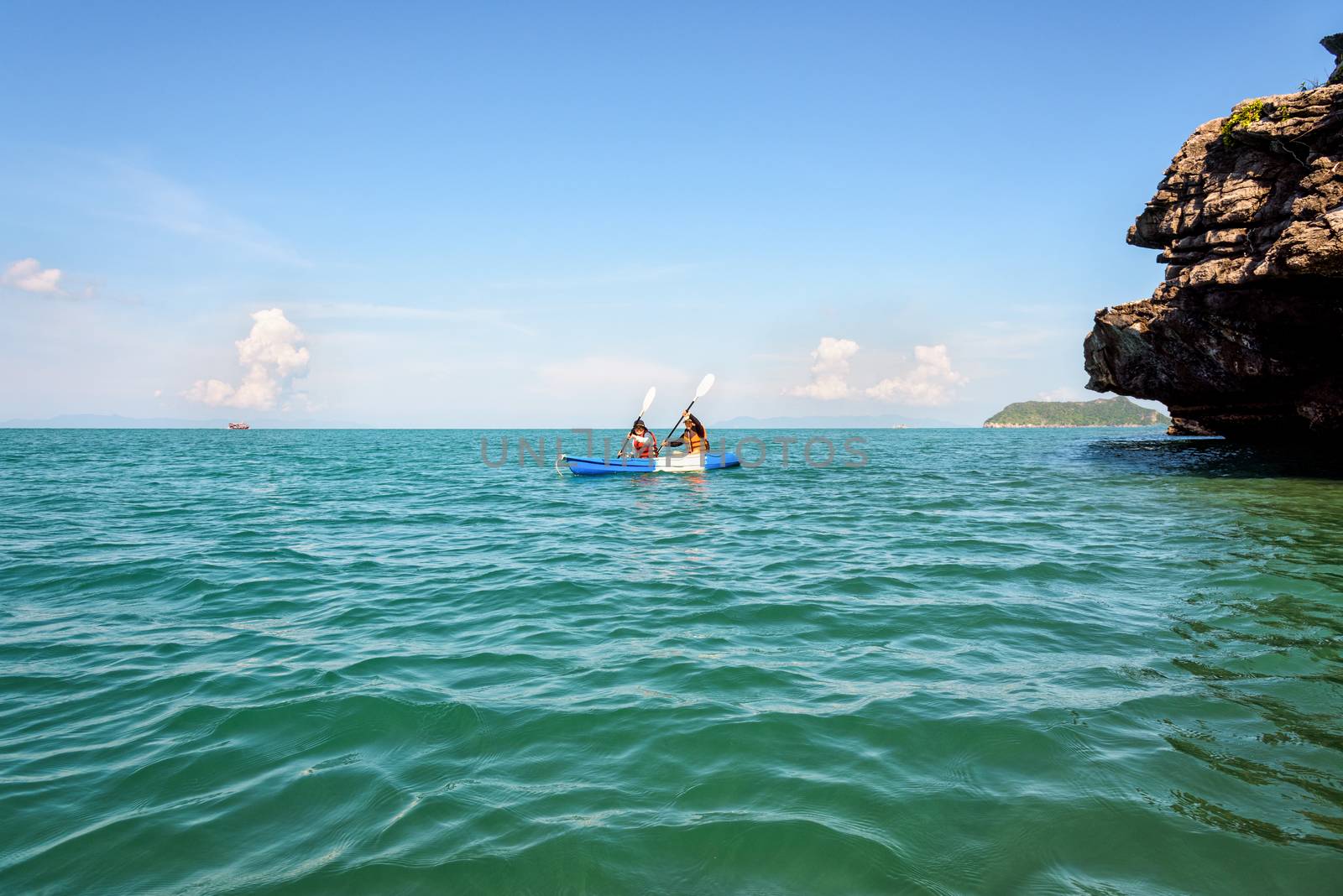 Two women are mother and daughter. Travel by boat with a kayak happy under the blue sky summer around Ko Phi view the beautiful nature of the sea and island, Mu Ko Ang Thong National Park, Surat Thani, Thailand