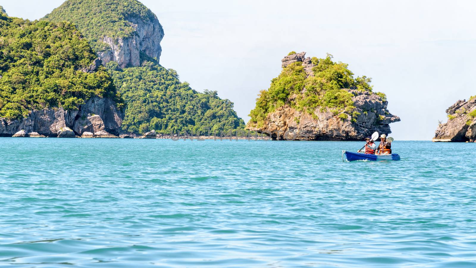 Two women are mother and daughter. Travel by boat with kayak view the beautiful natural landscape of the blue sea and island at summer, Mu Ko Ang Thong National Park, Surat Thani, Thailand, 16:9 widescreen