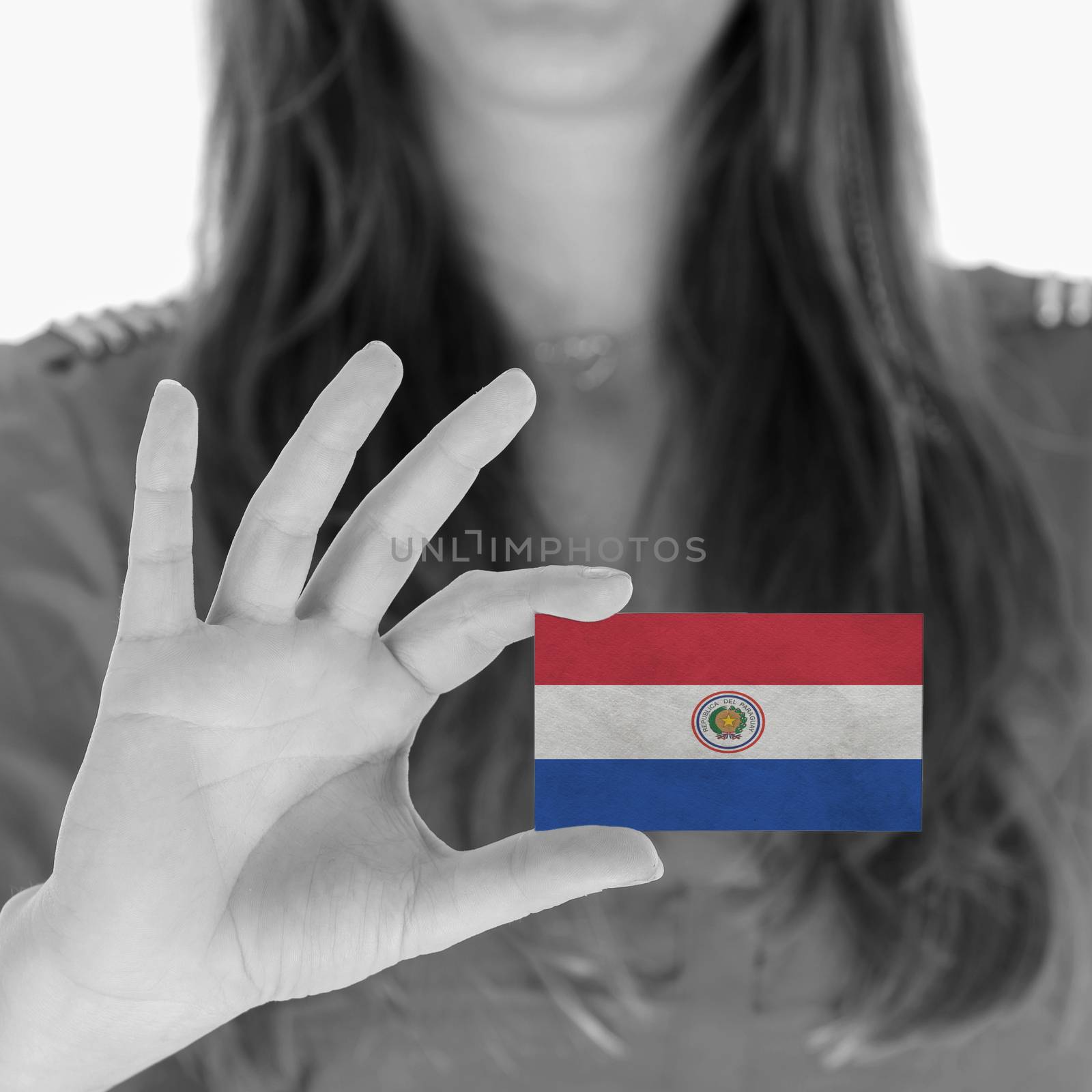 Woman showing a business card - Paraguay by michaklootwijk