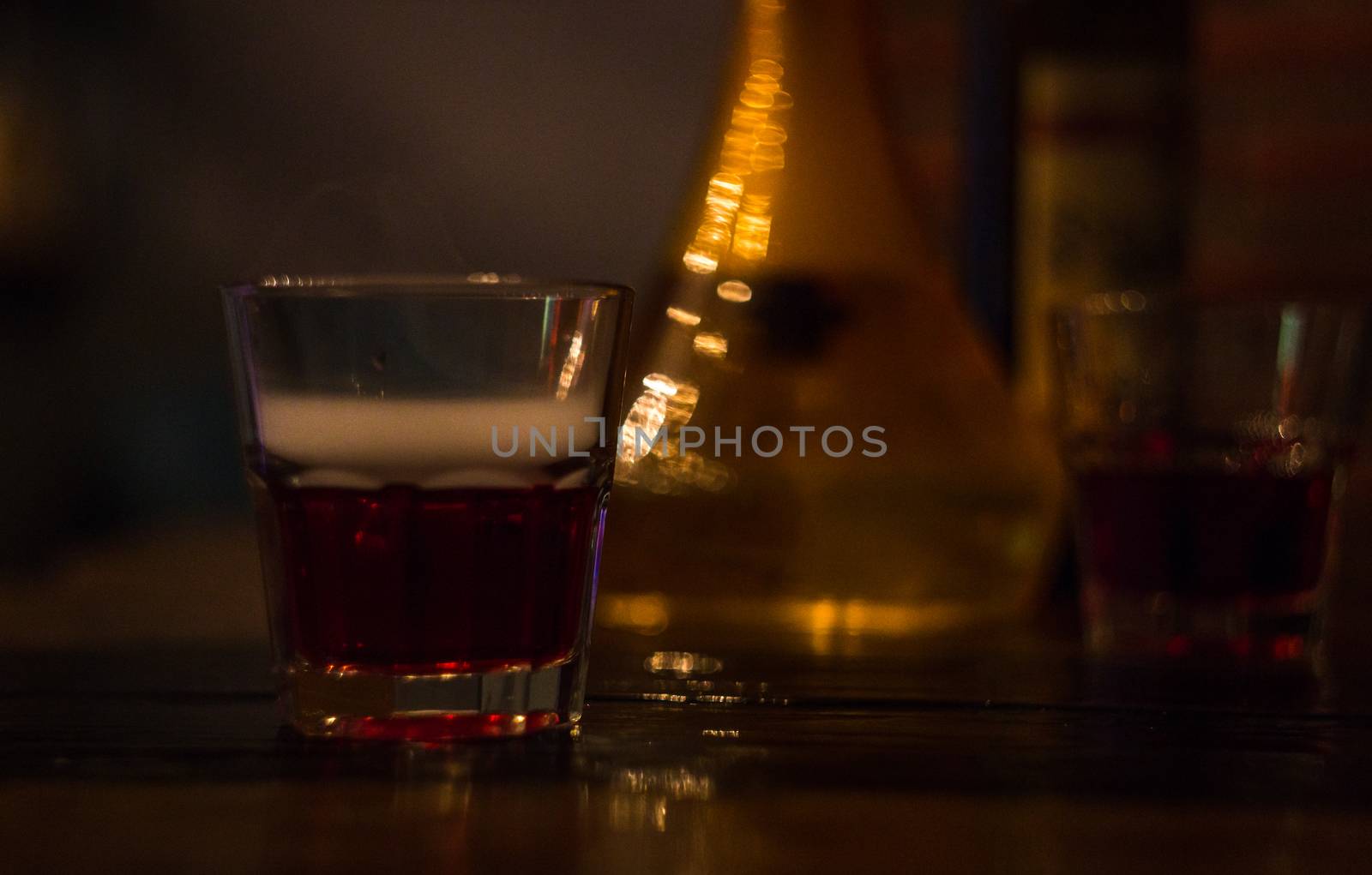 two glasses of red wine bar phone hookah