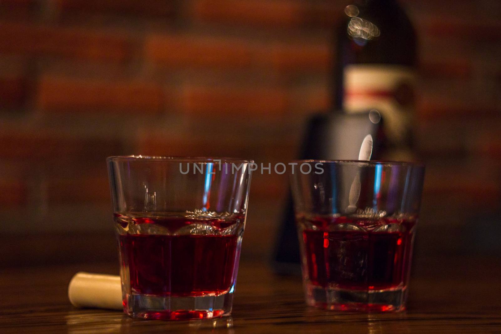 two glasses of red wine bar phone hookah