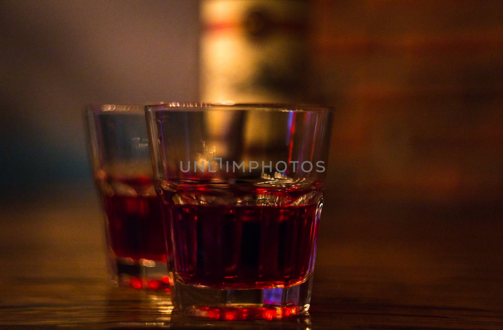 two glasses of red wine bar phone hookah