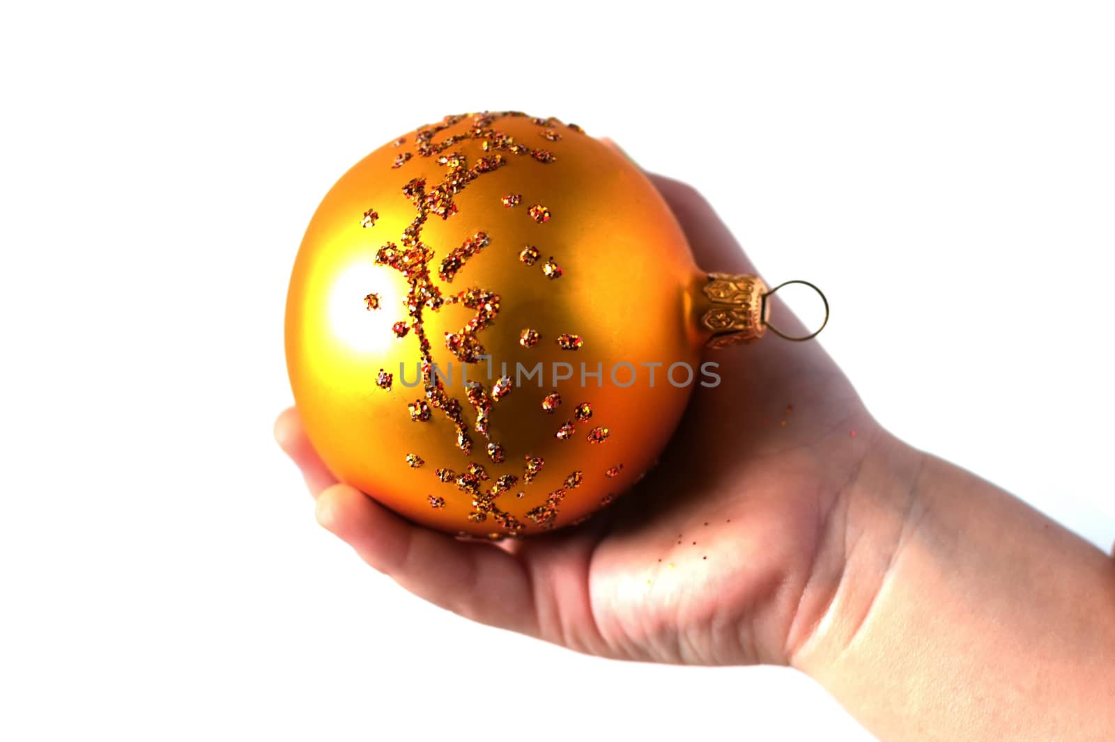 nursery hand holding a Christmas toy isolated on white background