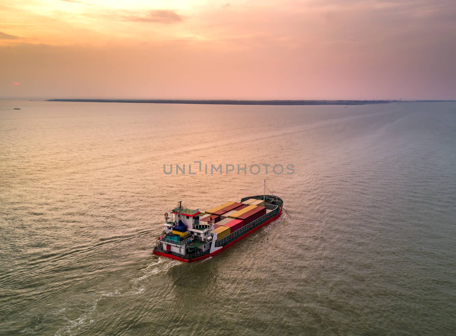 Medium container ship at estuary by Obmeetsworld