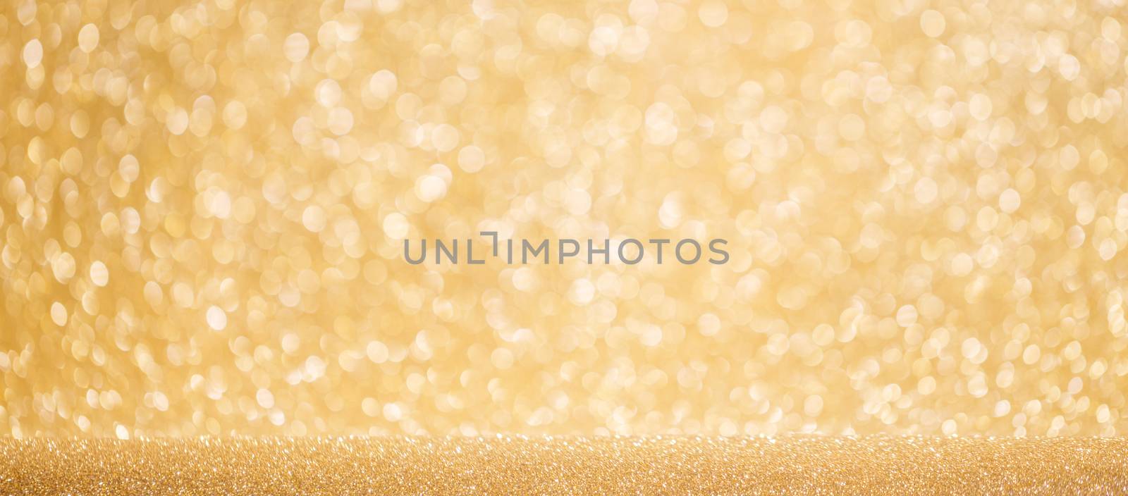 Shiny golden bokeh glitter lights abstract background, Christmas New Year party celebration concept