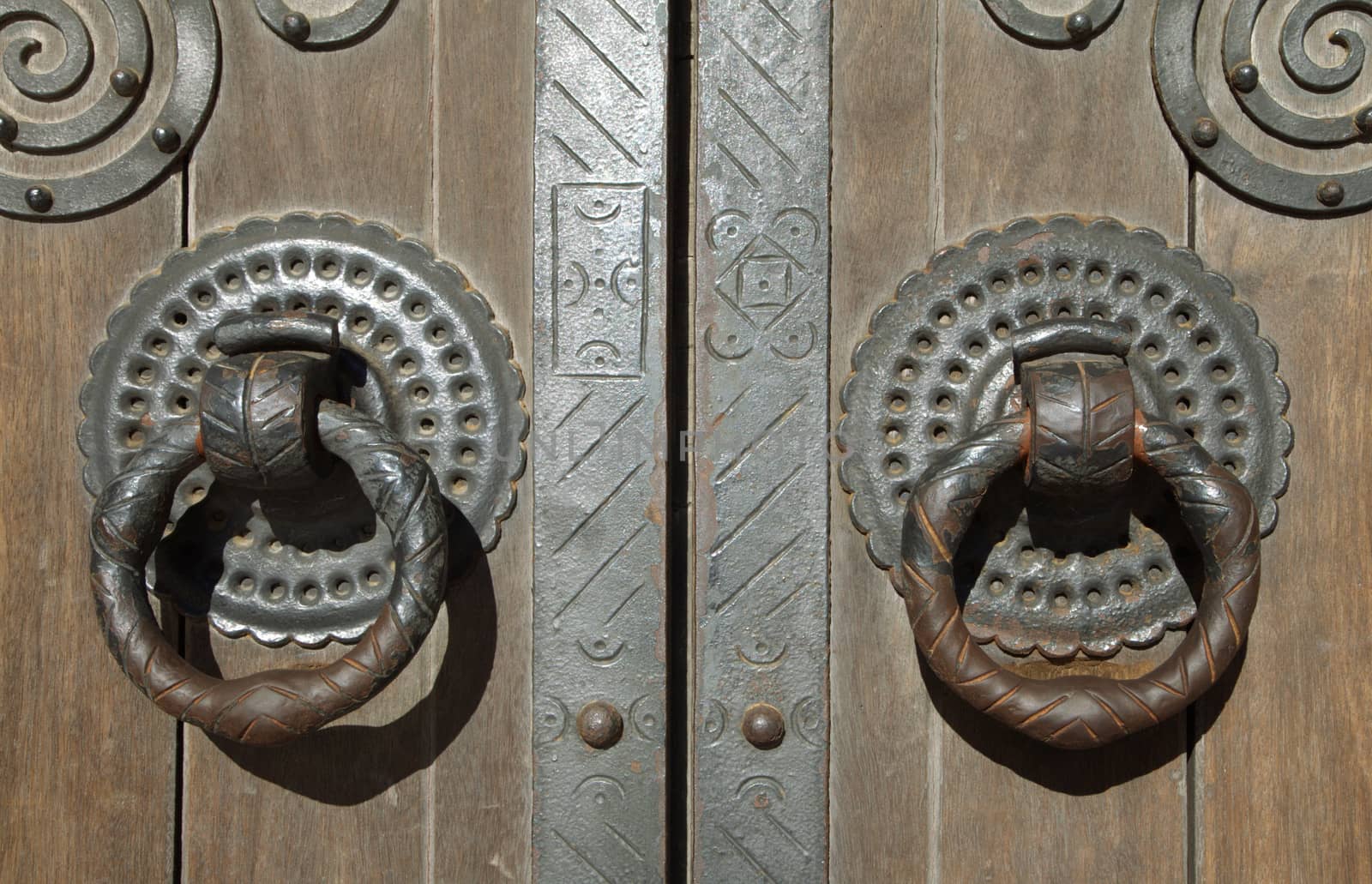 Close up of two old door knockers, Lisbon cathedral