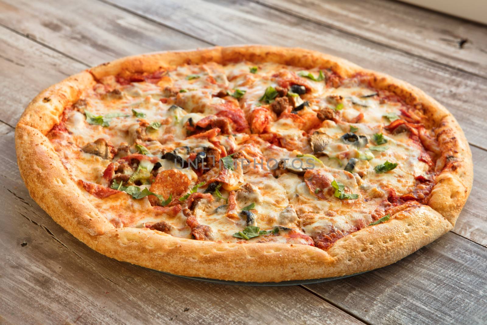 Pizza on an old wooden table