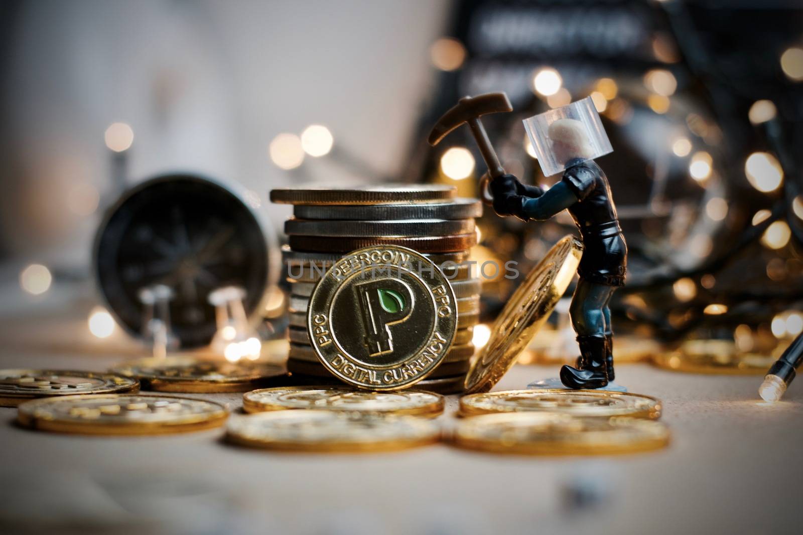 Crypto currency physical gold metal peercoin coin. Christmas concept.