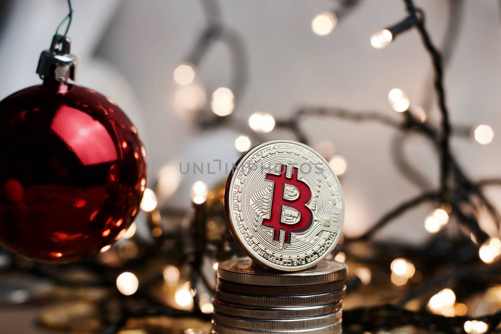 Crypto currency physical metal bitcoin coin. Digital currency christmas concept.
