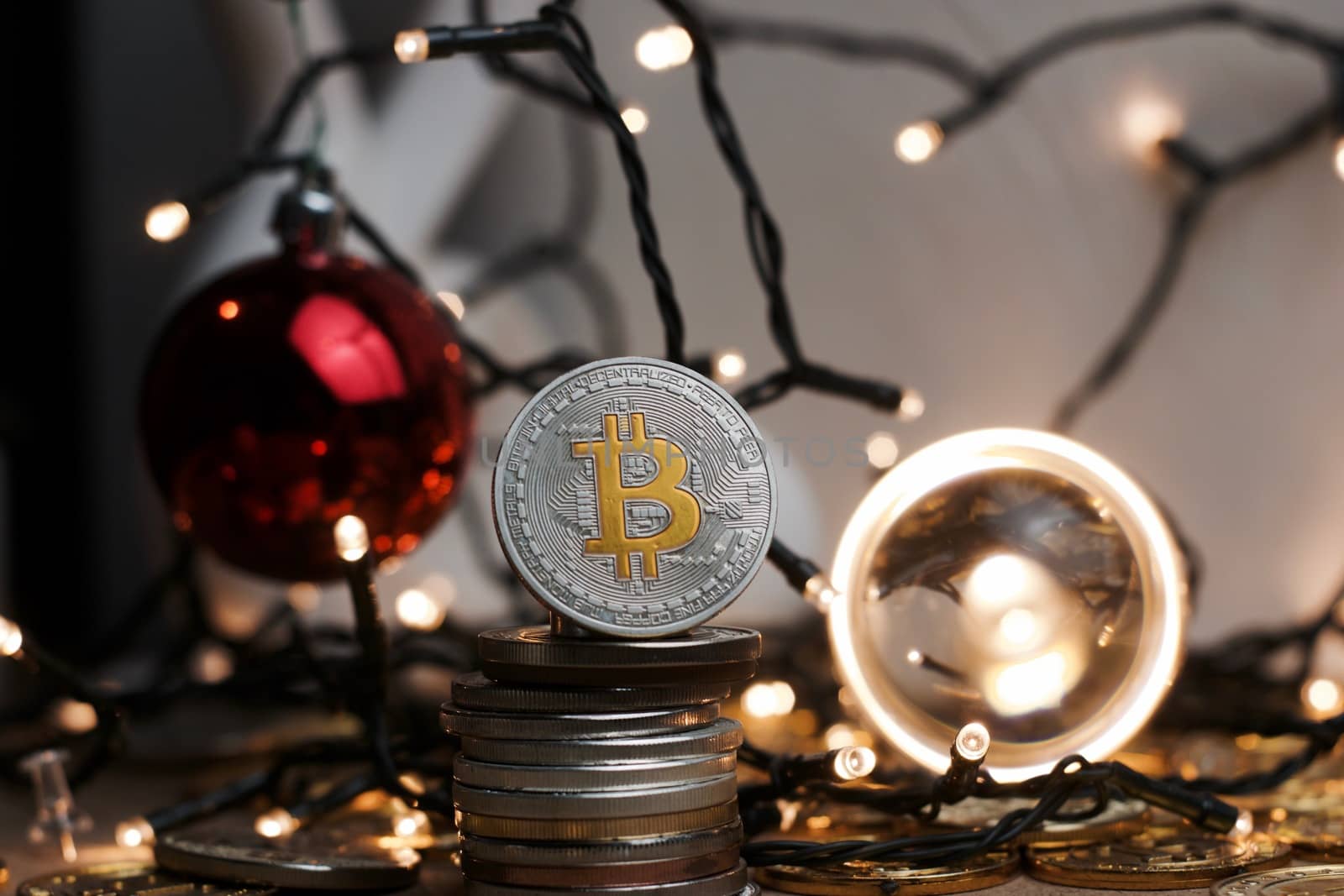 Crypto currency physical metal bitcoin coin. Digital currency christmas concept.