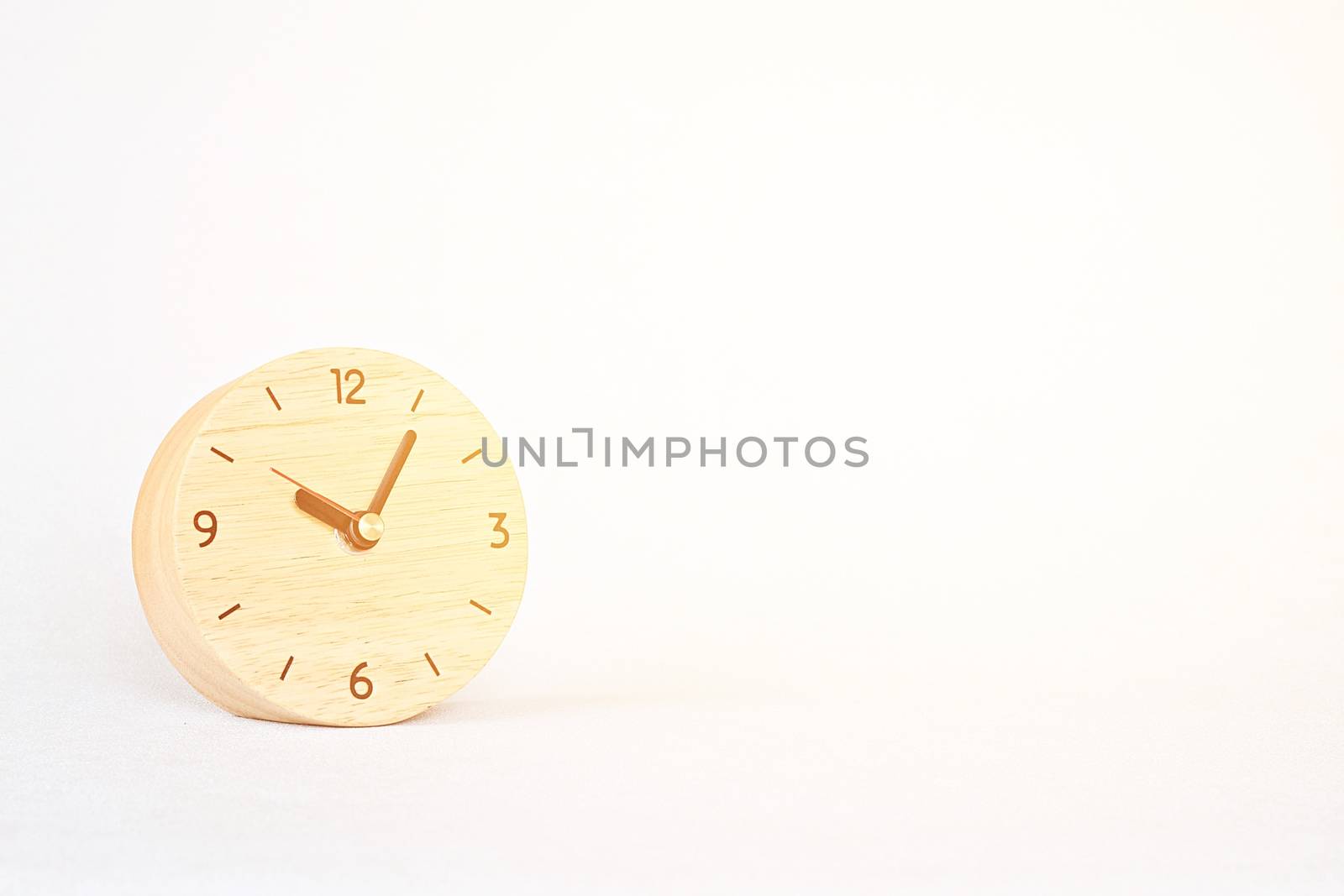 Business, savings time, deadline or delay concept : wooden alarm clock on white background