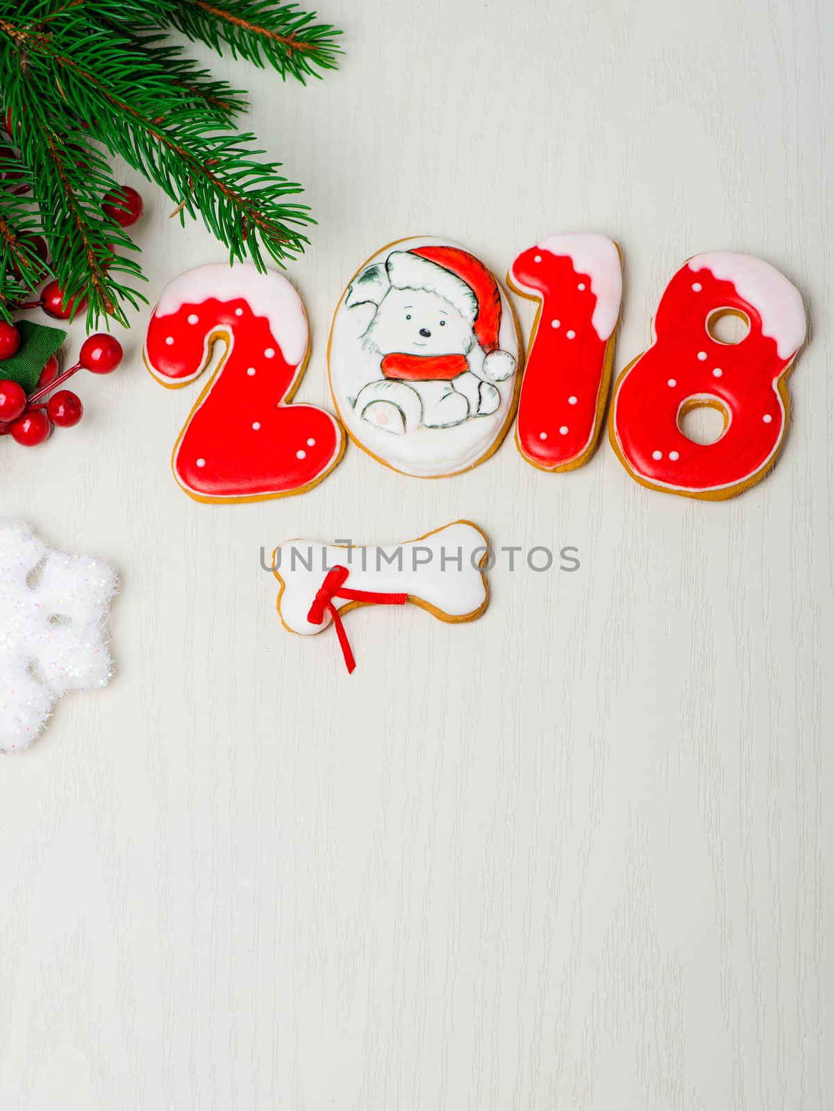 Christmas background with gingerbread, Christmas trees and snowflakes with pine cones. 2018 year of the dog