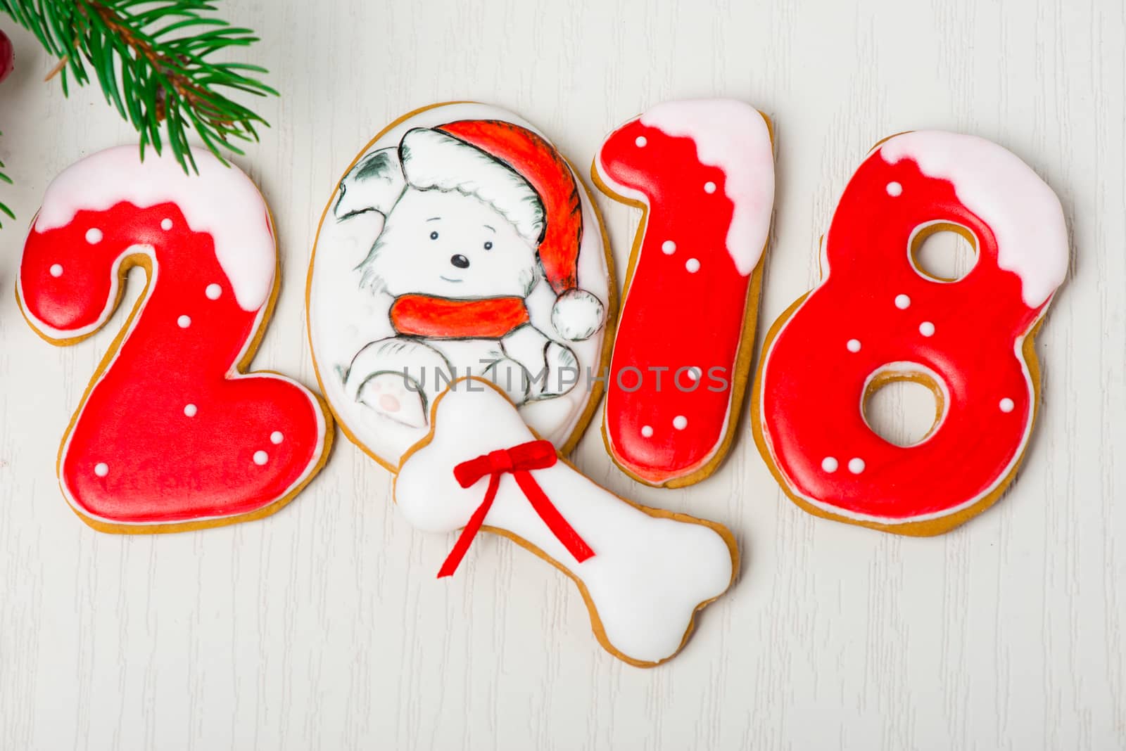 Christmas background with gingerbread, Christmas trees and snowflakes with pine cones. 2018 year of the dog