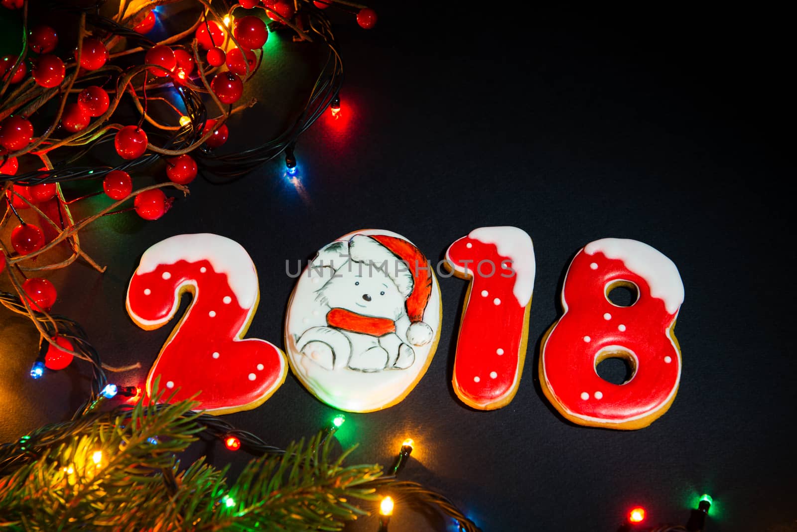 Christmas background with gingerbread, Christmas trees and snowflakes with pine cones. 2018 year of the dog