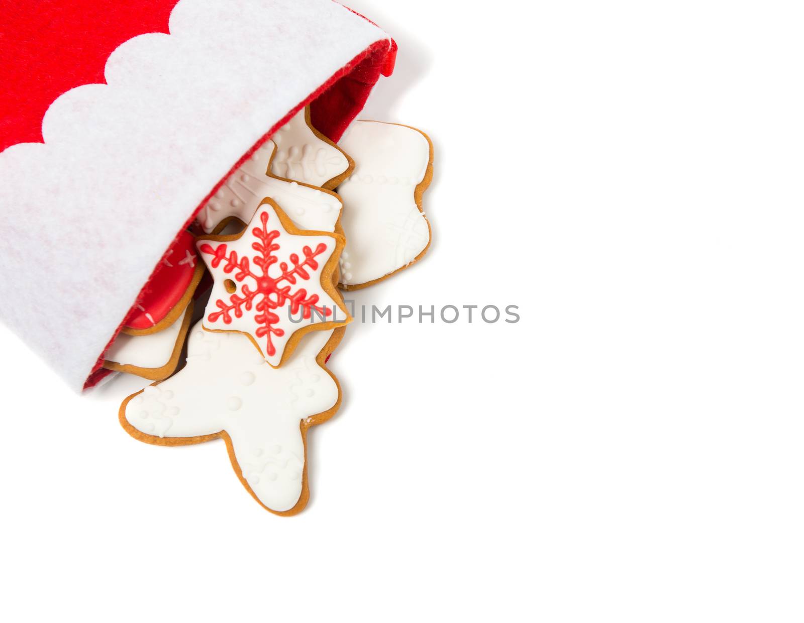 Christmas concept. Christmas sock with gingerbread on white background